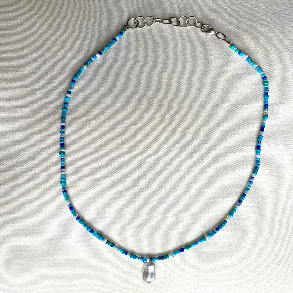 Multicolored blue necklace with pearl charm and silver chain